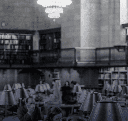 People reading in a large library