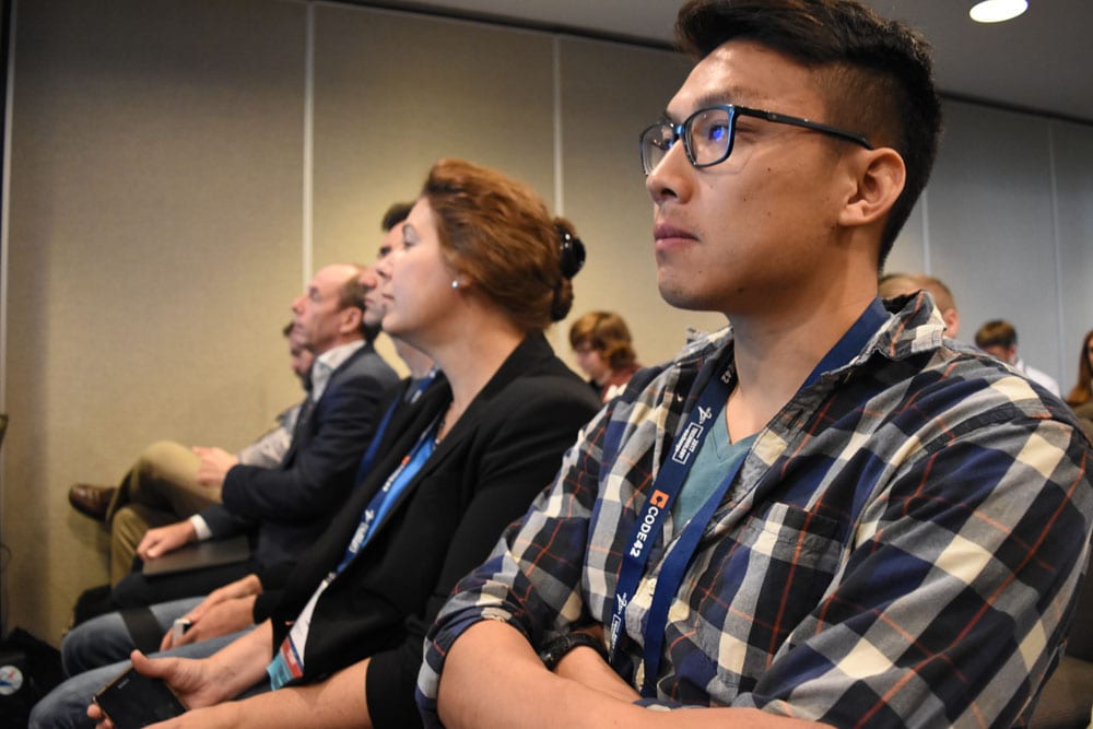 Attendees listening intently to a presentation