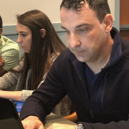 Three people participating in a workshop.