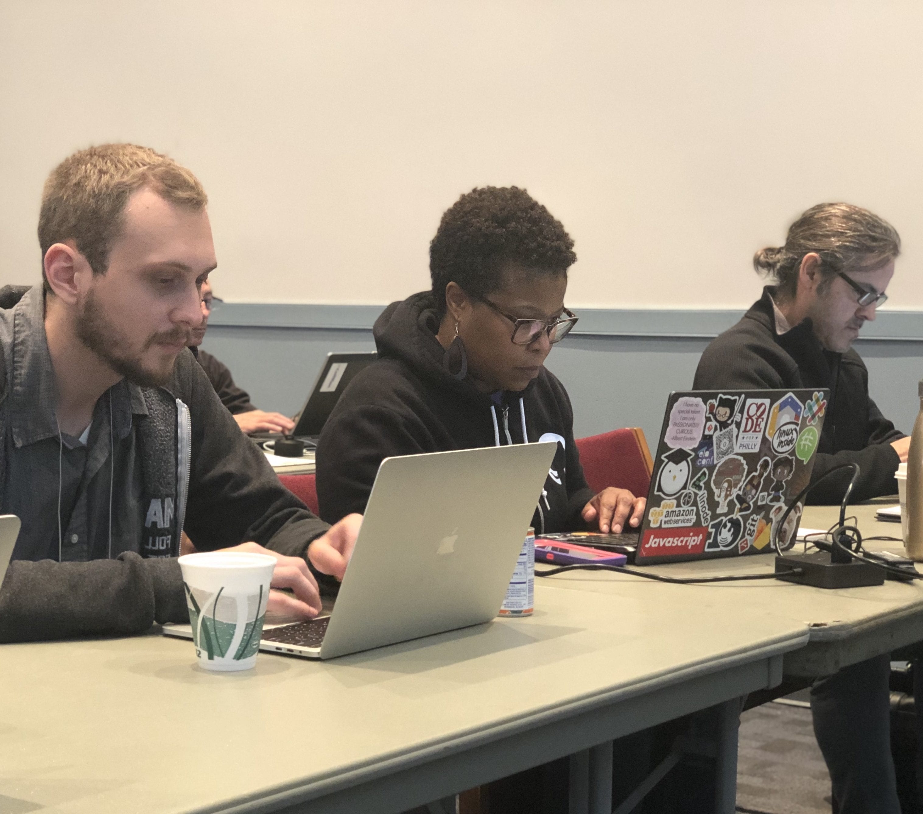 Three people participating in a workshop.