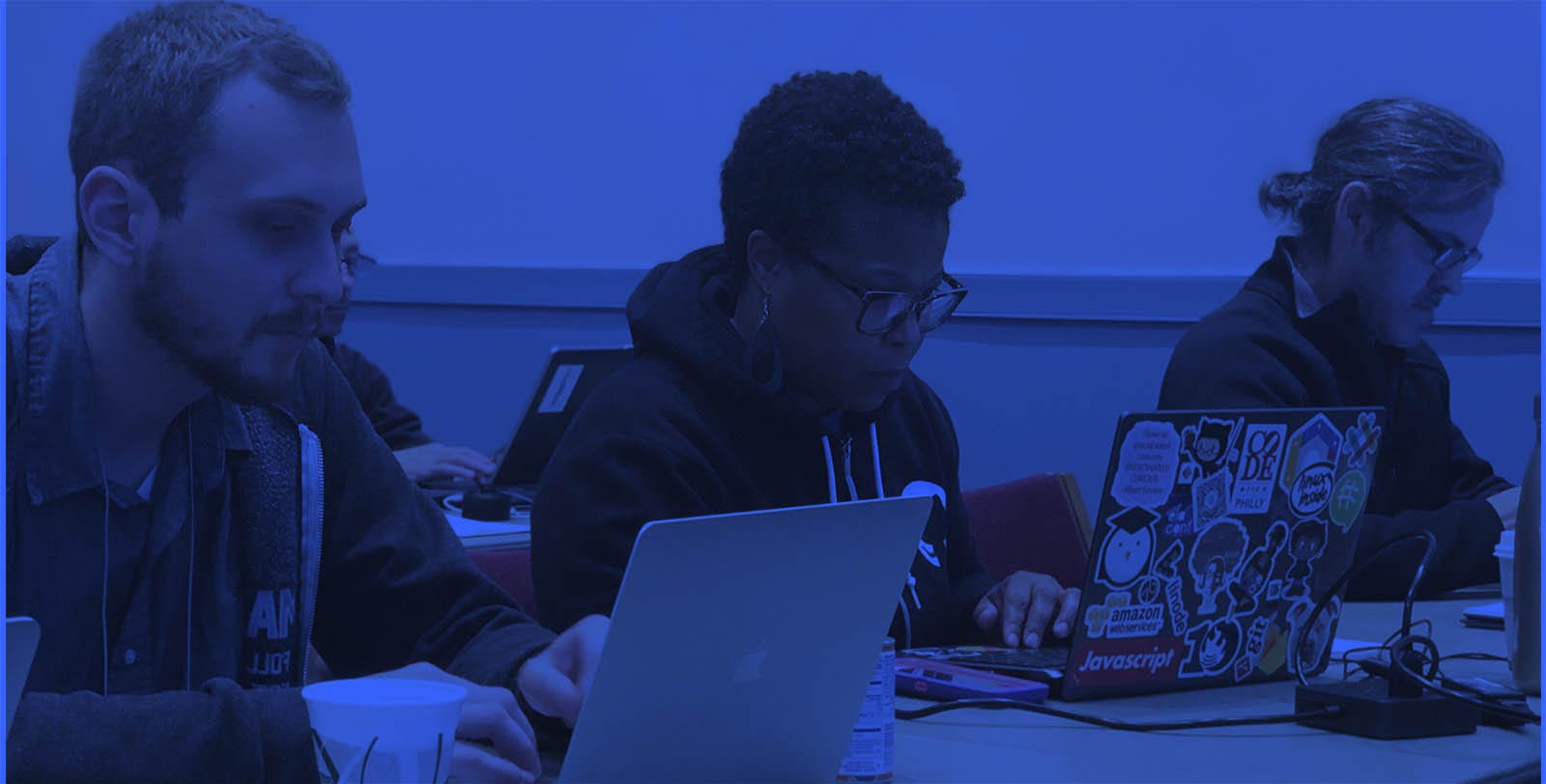 Close-up of three people at a software training session.