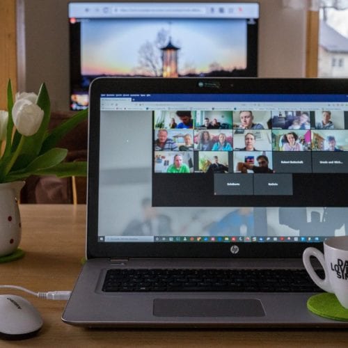 Photo illustration of a laptop featuring a webinar